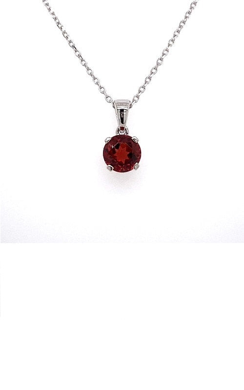 Round ruby pendant with a silver chain.