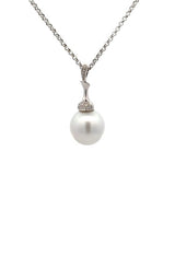 Silver necklace with white pearl pendant with diamond accents