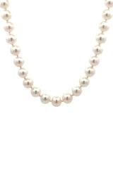 White pearls necklace on a white background