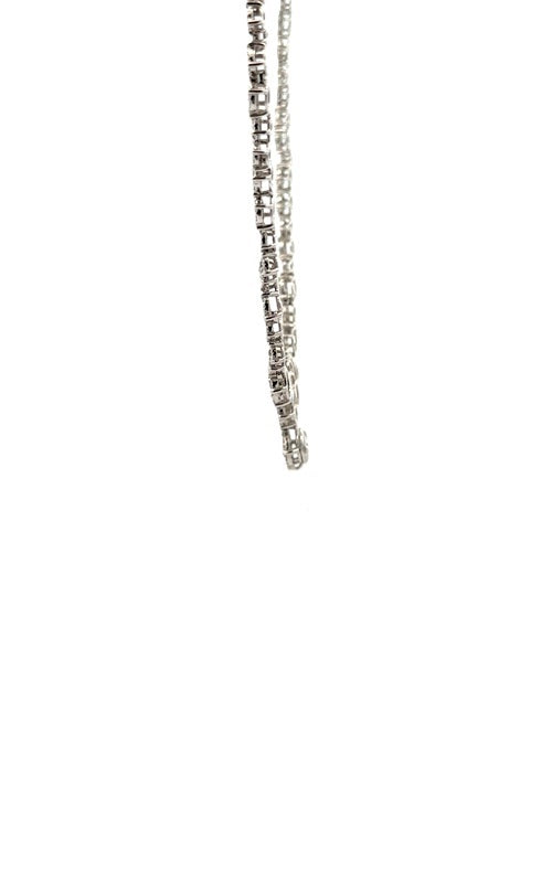 Side view silver necklace with round-cut diamonds in a cascading, floral-inspired design.