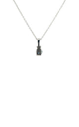 Back view silver necklace with a teardrop-shaped blue sapphire pendant