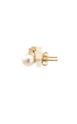 Side view of pair of gold pearl stud earrings.