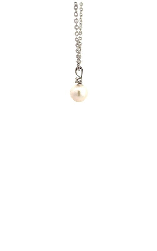 Side view of silver necklace with white pearl pendant with diamond accent