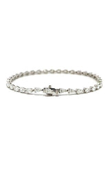 Silver tennis bracelet with pear-shaped diamonds.