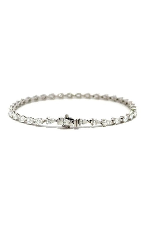 Silver tennis bracelet with pear-shaped diamonds.