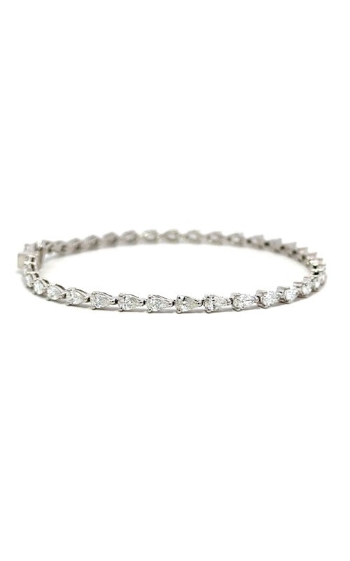 Silver tennis bracelet with pear-shaped diamonds.