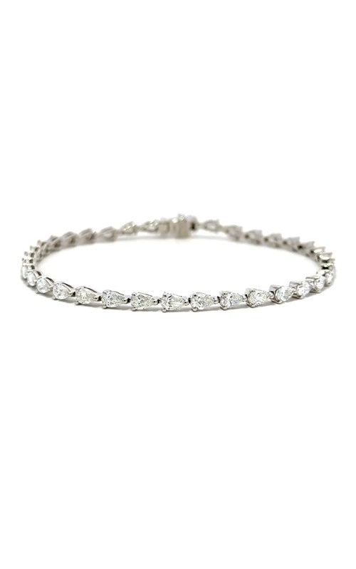 Silver tennis bracelet with pear-shaped diamonds.