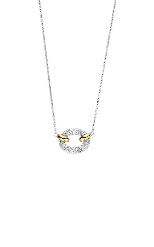 Necklace featuring a circular pendant with a gold-plated edge and pavé diamonds, suspended from a silver chain.