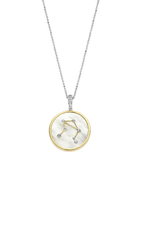 Silver chain necklace with a circular pendant featuring the Libra zodiac sign in gold and diamonds.