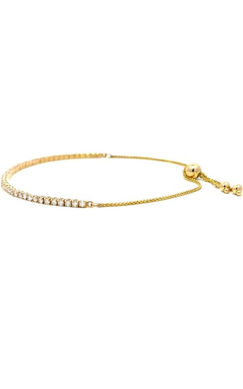 Gold adjustable bracelet with a sliding clasp and multiple small beads.