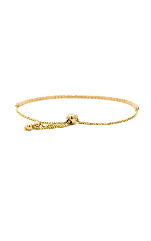 Gold adjustable bracelet with a sliding clasp and multiple small beads.