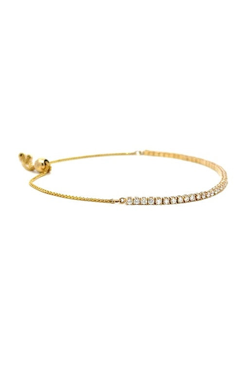 Gold adjustable bracelet with a sliding clasp and multiple small beads.