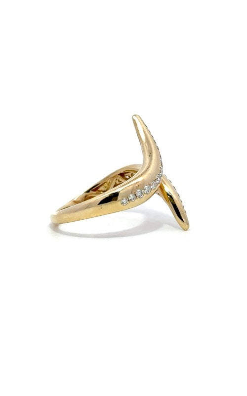 Gold ring with diamond accents, featuring a curved, open-ended design.