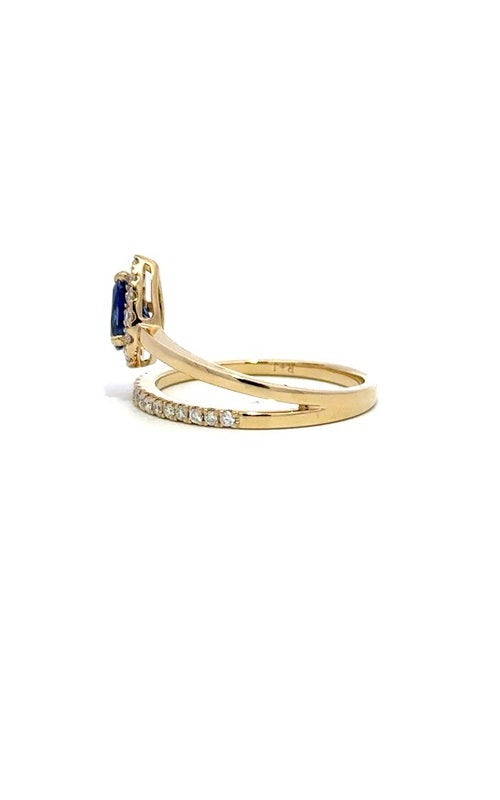 Gold ring with a split shank design, featuring a cushion-cut sapphire surrounded by a halo of smaller diamonds.