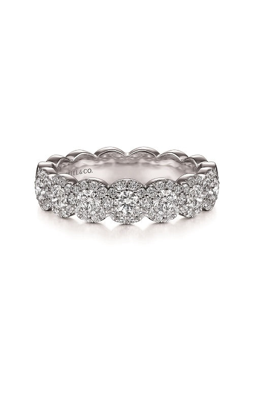 Silver diamond band with multiple rows of round-cut diamonds, each surrounded by smaller diamonds