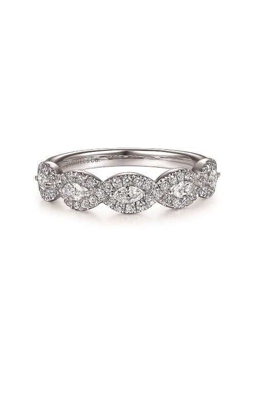 Silver band ring featuring five oval-shaped diamond halos contains multiple smaller diamonds surrounding a larger center stone.