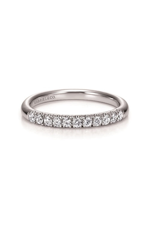 Silver ring with a diamond in pave setting  on a white background.