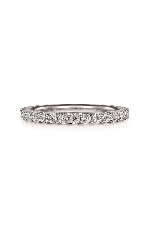 Silver ring with a diamond in share prong setting  on a white background.