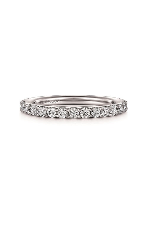 Silver ring with a diamond in share prong setting  on a white background.