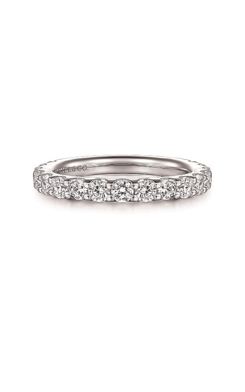 Silver ring with a diamond in share prong setting  on a white background.