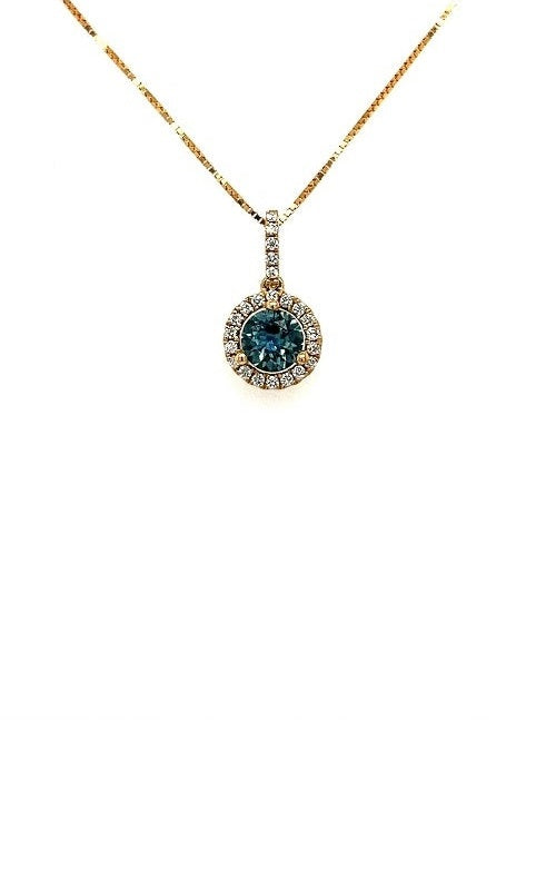 Oval blue sapphire pendant with diamond halo in a yellow gold setting, on a gold chain.