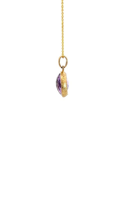 Side view of a gold chain with an oval amethyst pendant.