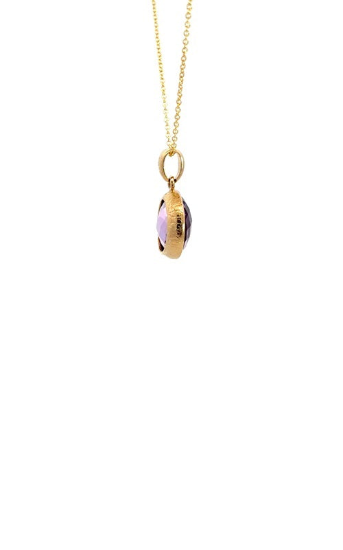 Side view of a gold chain with an oval amethyst pendant.