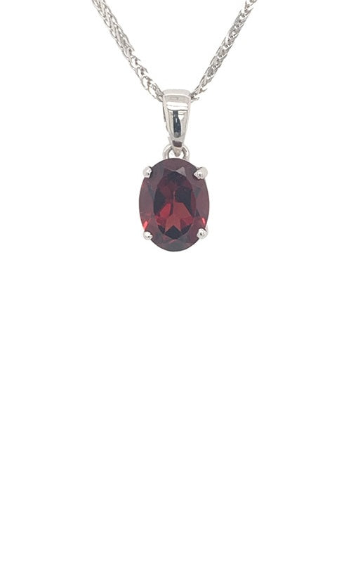 Oval ruby pendant with a silver chain.