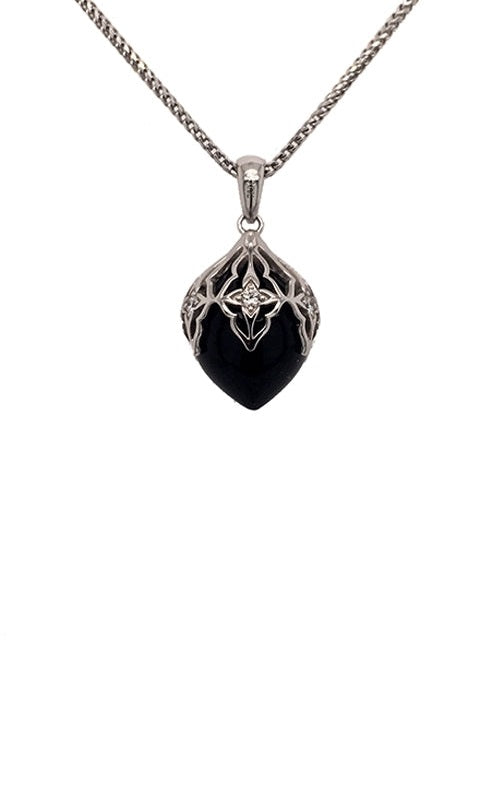 Heart-shaped onyx pendant with diamond accents in a silver filigree setting, on a silver chain.