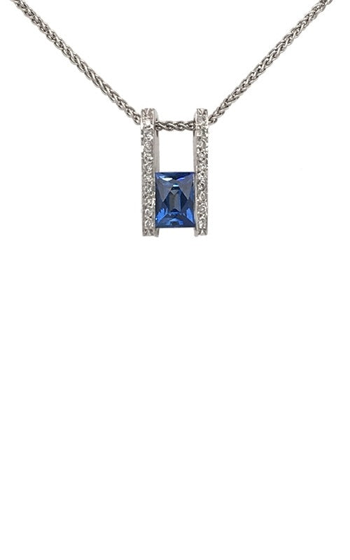 Rectangular blue sapphire pendant with diamond accents in a white gold setting with a double bar design.