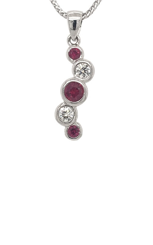 Silver pendant featuring a ruby and diamond in bezel setting